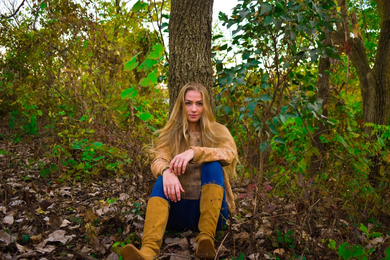 Golden-hour portrait, colour graded with warm amber light.